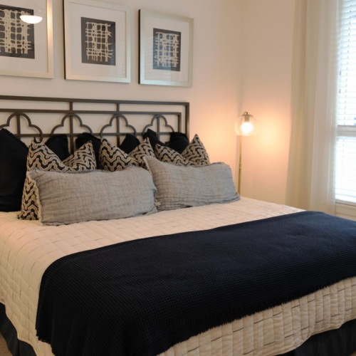 Sleep in style carpeted bedroom with large window